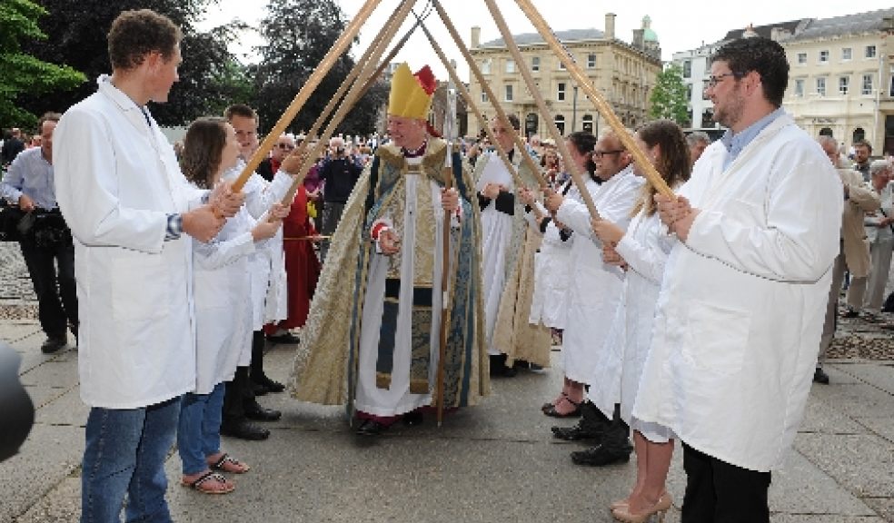 The Rt Rev Robert Atwell enters the Cathedral as Devon Young Farmers form a 'guard of honour'