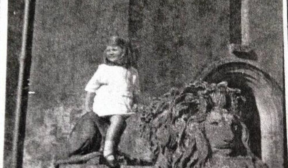 Girl on mystery lion