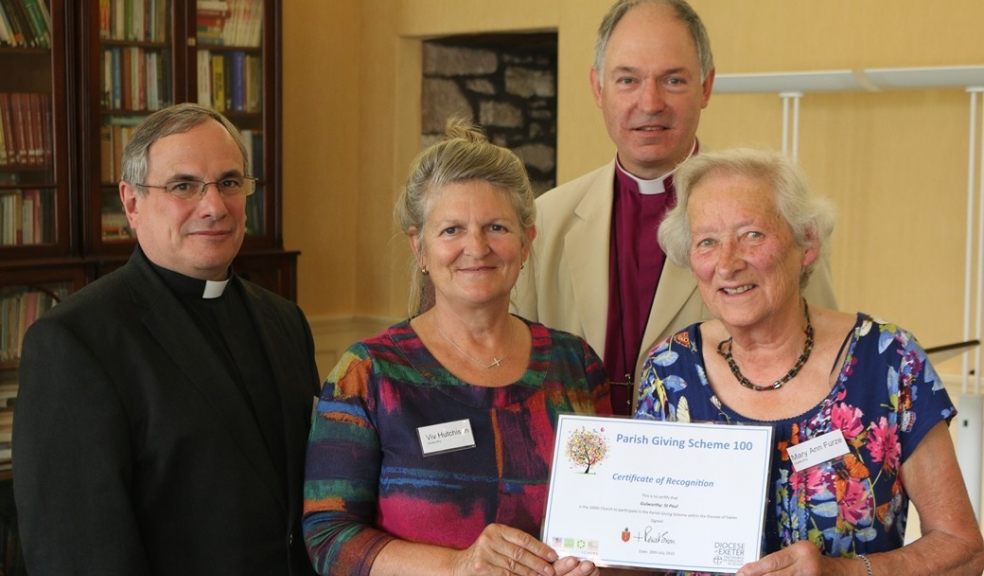 Rev Christopher Hardwick, Viv Hutchison and Mary Anne Furze from Gulworthy receive their certificate from Bishop Robert as the 100th church to join the Parish Giving Scheme. Photo courtesy of Exeter Diocese.