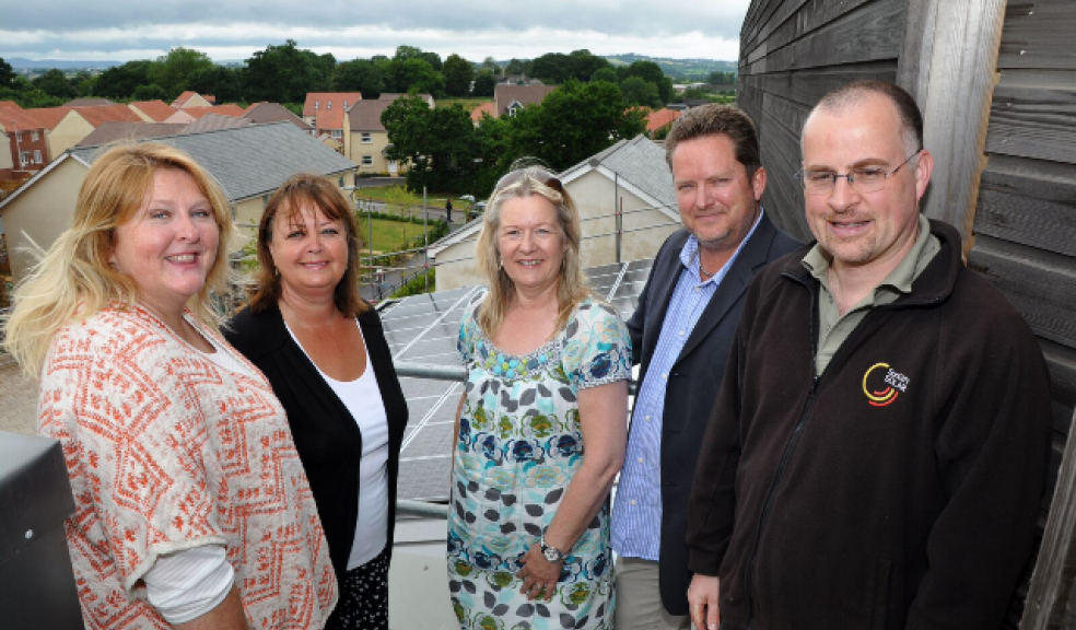 On the roof of the Younghayes Centre in Cranbrook are (l-r) Kate Jenkins from E.ON, Kim Bloxham and Karen Jennings from CHIC, Mark Simpson from E.ON and Gareth Walton of Sungift Energy
