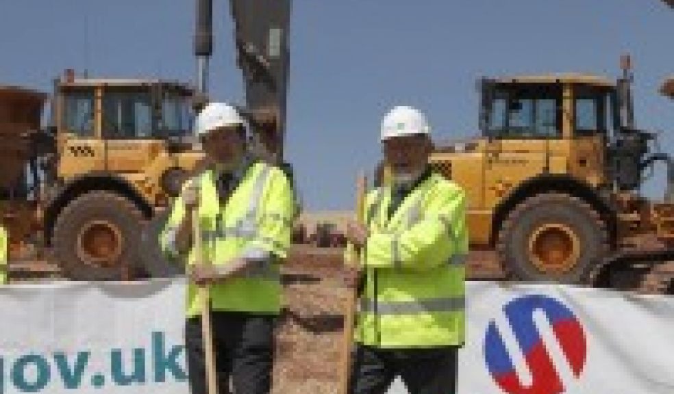 Cllr Andrew Leadbetter (left) and Cllr Bernard Hughes (right) mark the start of work on Crediton's new link road