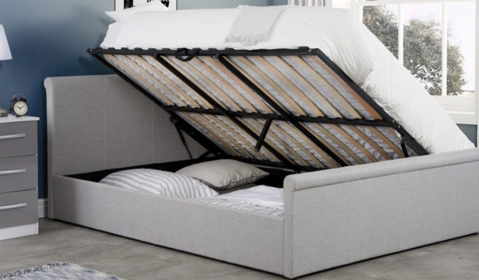 ottoman bed open showing under bed storage in bedroom