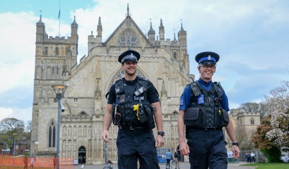two policemen stand-in outside Exeter Cathedral