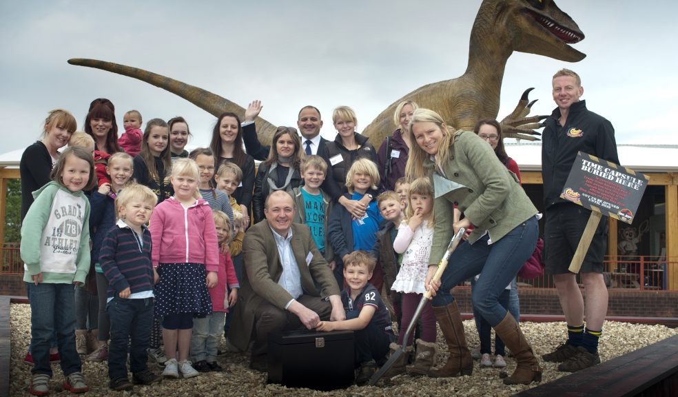 Managing Director Chris Down joined by his family, media and their families bury a special 25th anniversary time capsule outside Dino Jeeps