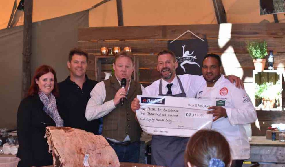 L-R: Caroline Creer, Fundraising and Communications Director at Devon Air Ambulance; James Dart, Co-Owner of Darts Farm; David FitzGerald, BBC Radio Devon Presenter; Alastair David, Master Butcher at The Butchers at Darts Farm; Michael Caines MBE, Head Chef at Gidleigh Park. The cheque for the sums raised from the sale of last year's winning sausage is presented to Caroline on behalf od Devon Air Ambulance.