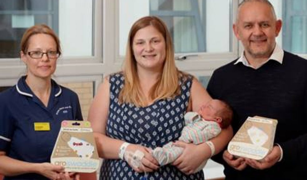 L-R: Jo Bassett Senior Midwife at Royal Devon and Exeter Hospital, Katie Fletcher, new mum to Evie and the first parent to receive this gift, and Rob Pascoe Group Commercial and Marketing Director at the Gro Company