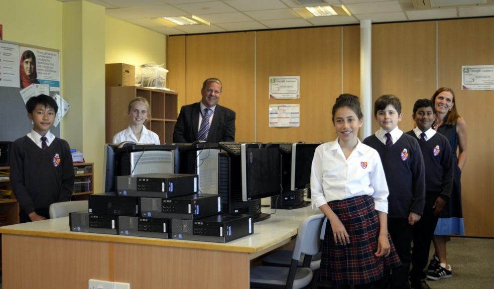 Phil Randall, Headteacher, St Peter's Secondary School with Louise Edwards, Marketing Director, Michelmores and chilren Lucy, Freddie, Gabriel, Warren and Sofia
