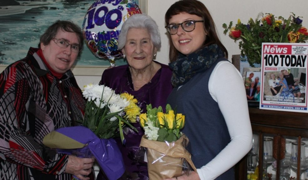 Mrs Millard (centre) receives her flowers from Councillor Jill Elson (left) and Support Services Manager Amy Gilbert.