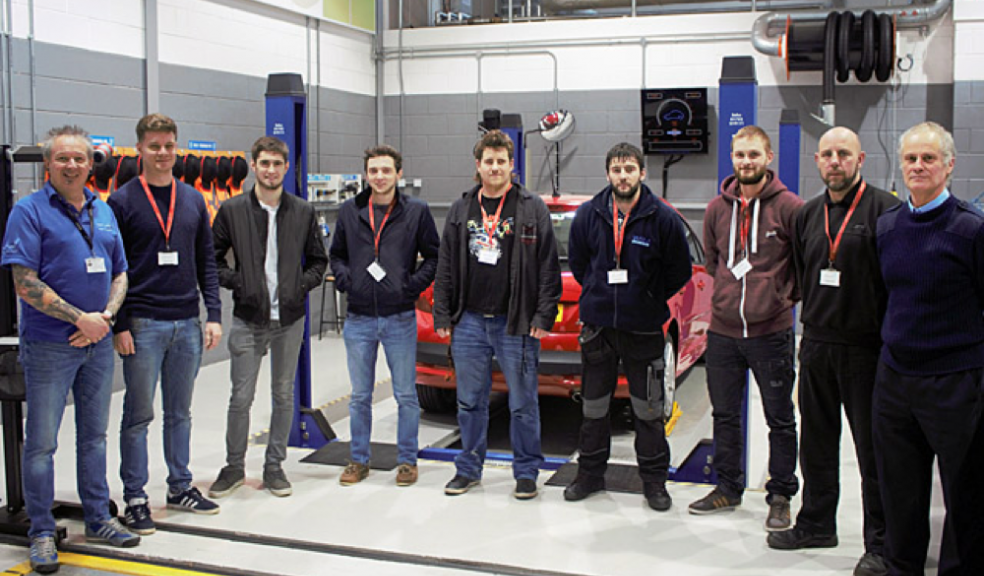 Exeter College MOT trainers Darren Smyth on the left and Chris Fuge on the far right, with some of their successful candidates