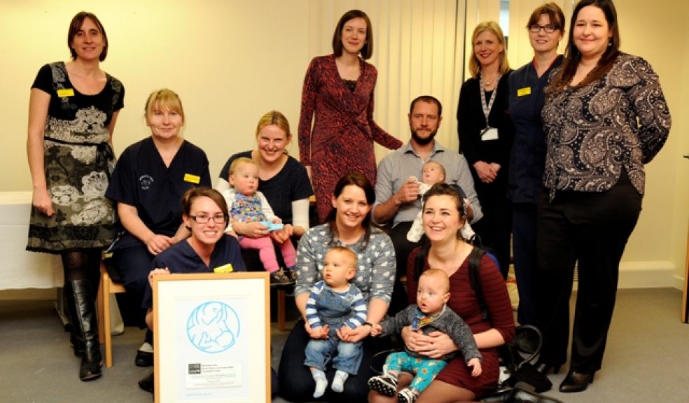 Staff and parents celebrate the award