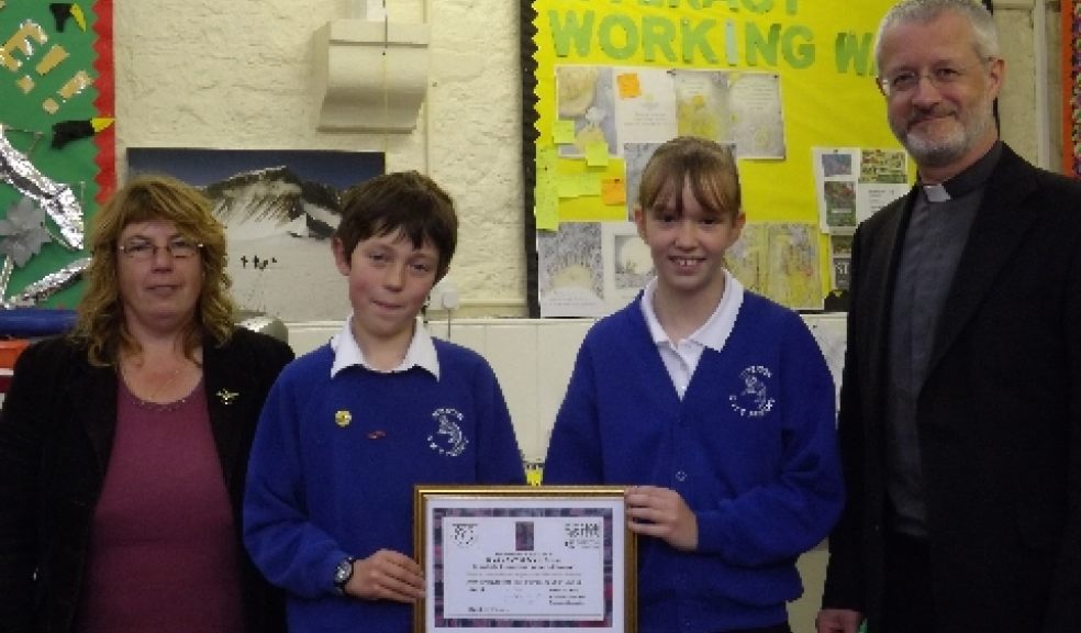The Archdeacon of Exeter presented the certificate to the school