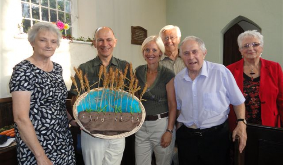 Andrew Cutler holding the Harvest Plaquewith his wife Ginnie, and left Marion Nosworthy of the Sandford Congregational Church, and three local parishioners - Alan Hooper, and Colin and Julie Rowe. Photo: Margaret Tucker.