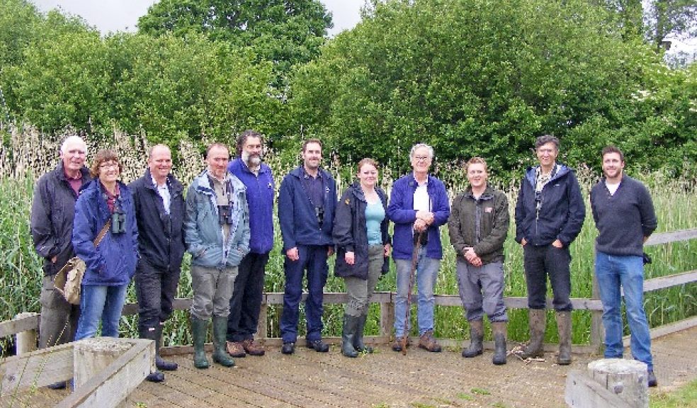Steve Edmonds (EDDC) and Mike Lock with Pete & Lesley Clarke (AVDCS) with the tour party from Poole in front of the Axe Estuary Wetlands lassroom reedbeds.