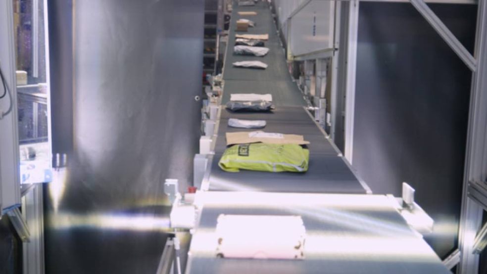 Photo caption: The Exeter Parcel Sortation Machine in action; A Royal Mail Parcel Sortation Machine in action