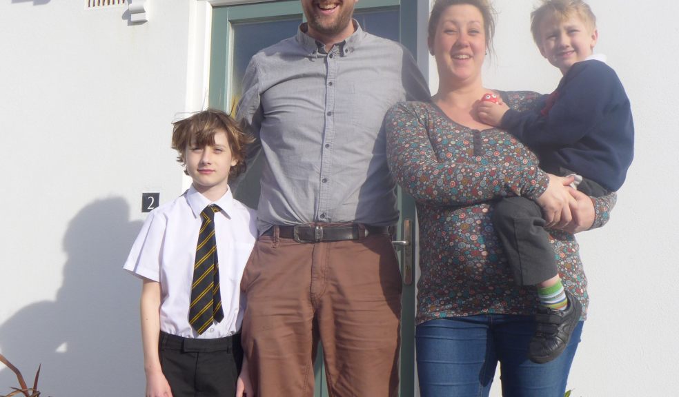 Photograph by Glen King : Sebastian (8) and OSCAR (4) with Warren Wilkins (41) and wife Gemma (32) pregnant with their third child outside their C G Fry & Son Home in Tregunnel Hill, Newquay