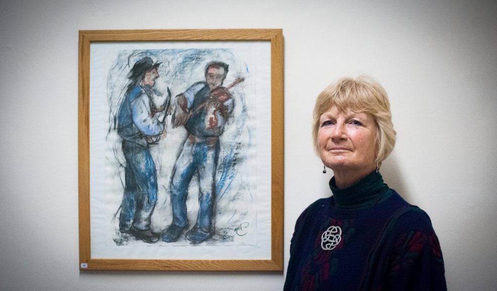 Artist Sarah Pressman with her work at WBW Solicitors in Exeter