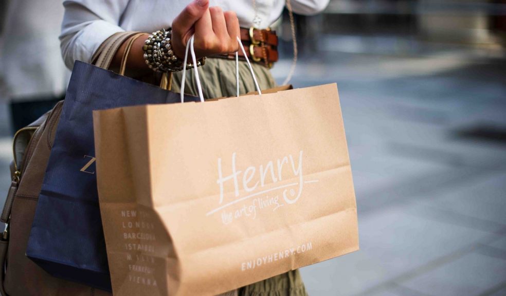 Shopping in Exeter woman with a handful of shopping bags