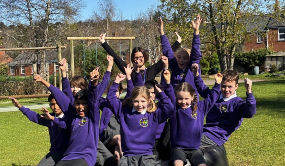 happy pupils in purple uniform celebrating St Sidwells School Exeter ousted report