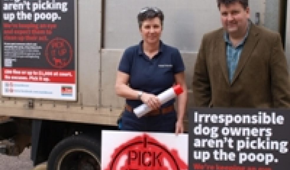 Councillor Iain Chubb is pictured with EDDC Dog Warden Amanda Lindfield with two of the posters and the spray paint stencil.