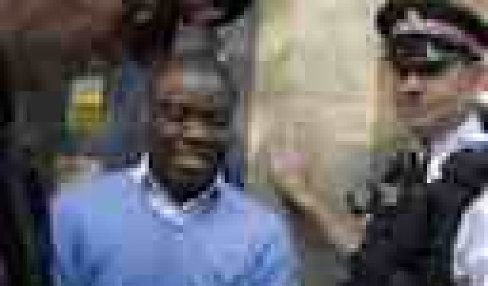 FILE This Friday, Sept. 16, 2011 file photo shows former UBS trader Kweku Adoboli, center, walking to a security van flanked by police officers after appearing at the City of London Magistrates Court in London. A rogue trader who lost $2.2 billion in bad deals at Swiss bank UBS was convicted of fraud on Tuesday, Nov. 20, 2012. Ghanaian-born Kweku Adoboli, 32, exceeded his trading limits and failed to hedge trades, allegedly faking records to cover his tracks at the bank's London office. At one point, Adoboli risked running losses of up to $12 billion. The fraud conviction carries a maximum jail term of 10 years. (AP Photo/Matt Dunham, File)
