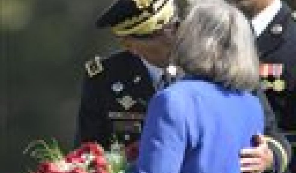 In this Aug. 31, 2011 file photo, former Commander of International Security Assistance Force and U.S. Forces-Afghanistan Gen. Davis Petraeus kisses his wife Holly during an armed forces farewell tribute and retirement ceremony at Joint Base Myer-Henderson Hall in Arlington, Va. Gen. Petraeus, the retired four-star general who led the U.S. military campaigns in Iraq and Afghanistan, resigned Friday, Nov. 9, 2012 as director of the CIA after admitting he had an extramarital affair. (AP Photo/Susan Walsh, File)
