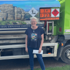 Julie Rickets, Moorland Fuels Heating Oil Winner Woman stood in front of Moorland Fuels Tanker