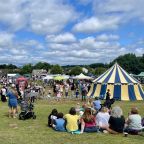 Image of visitors enjoying an outdoor summer community event. 