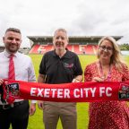 Pictured are, L-R, Tom Wenborn (ECFC) with Duncan Worthington and Hannah Barnard from Taking Care.