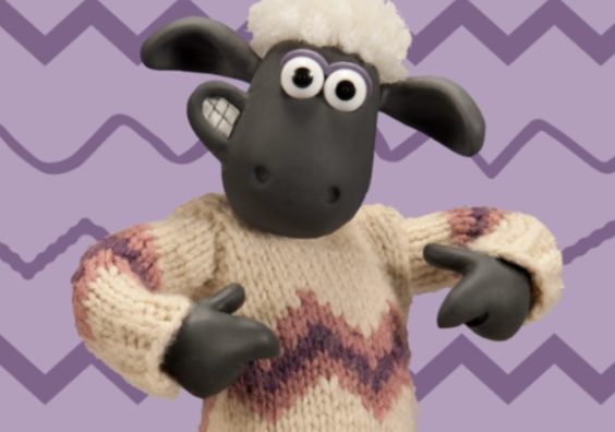 Shaun the sheep wearing a knitted jumper