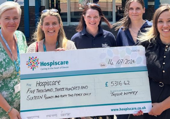 Taylor Wimpey and Hospiscare employees at the charity's headquarters in Exeter.