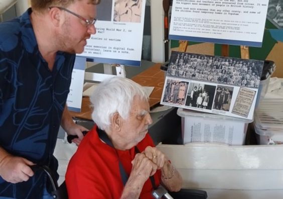 Eddie with Luke Portnow looking at the exhibition.