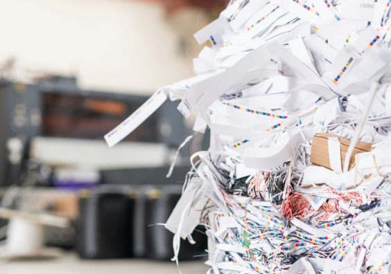 Close-up of cut papers heap produced with linotype machine at printing house