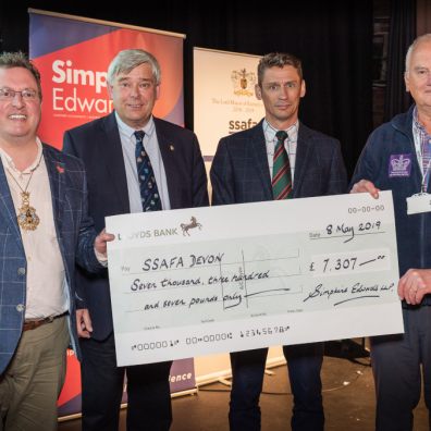 Lord Mayor of Exeter, Councillor Rob Hannaford, John Coombs and Jean-Paul Quertier, partners at Simpkins Edwards, presenting Brigadier Andy Pillar OBE and Chairman of SSFA, Devon Branch with a Really Big Quiz cheque for over £7,000