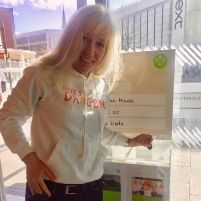 Lynne Barker-Privalova, one of Pete’s Dragons’ counsellors, votes with her green token as part of the John Lewis Community Matters scheme. 