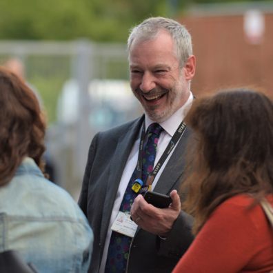 Principal John Laramy celebrates with Exeter College students