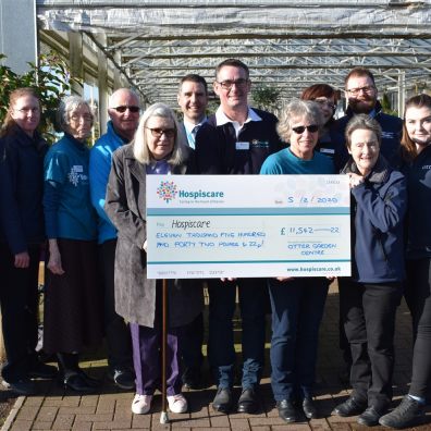 Group of people holding cheque