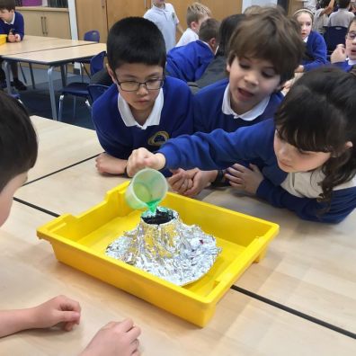 Children from the school experimenting with a foil 'volcano'