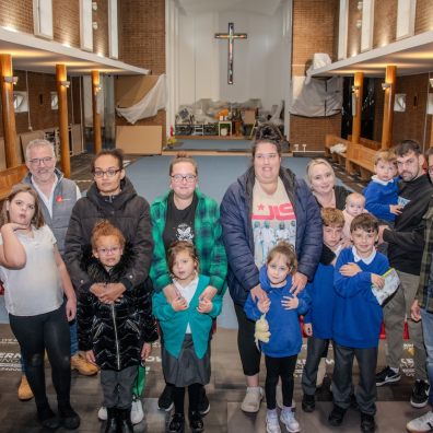 L-R - David Hawker from Dodd Group, Andy Butt from JK Floorheating, local families who attend servic