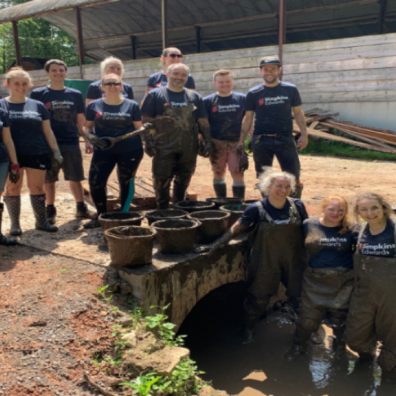  Staff from the Exeter office of Chartered Accountants Simpkins Edwards play a vital role in restoration of the historic Clapperentale Waterwheel,  Tale Valley, East Devon