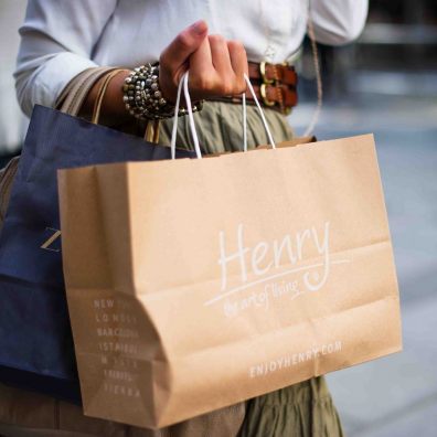 woman with a handful of shopping bags