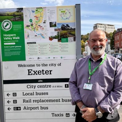 Cllr Duncan Wood pictured in front of the new sign at St David's Station